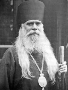 Свети Серафим Софийски Чудотворец – архиепископ Серафим (Соболев) в расо и с йерархическо украшение, държащ жезъл